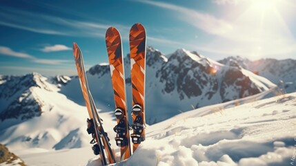 A pair of skis resting on top of a snow-covered slope. Ideal for winter sports enthusiasts and ski resorts - obrazy, fototapety, plakaty