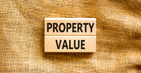 Property value symbol. Concept words Property value on beautiful wooden blocks. Beautiful canvas table canvas background. Business property value concept. Copy space.