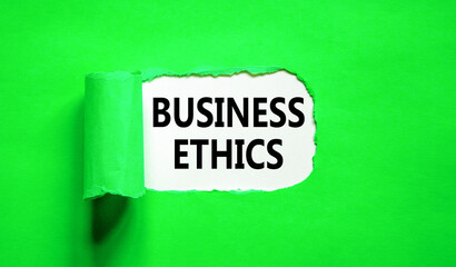 Business ethics symbol. Concept words Business ethics on beautiful white paper. Beautiful green paper background. Business ethics concept. Copy space.