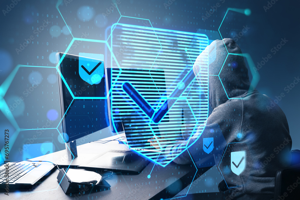 Fototapete Side view of hacker at desktop using laptop with glowing hexagonal shield hologram with binary coding on blurry background. Safety, hacking, malware and internet concept. Double exposure.