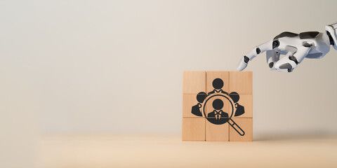 Using AI for recruiting concept. 3d rendering robot hand put ,pick or choose the one who got idea or special or right man for job than other in human resources management (hrm) or recruitment concept.