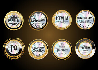 Premium quality gold and silver badges isolated on black background vector