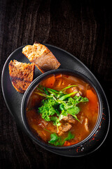 Shurpa soup with lamb meat in bowl