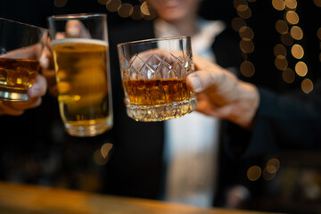 Barman pouring whiskey whiskey glass..