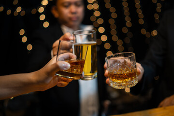 Fototapeta na wymiar Celebrate whiskey on a friendly party in restaurant