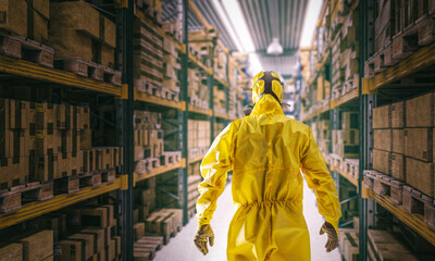 man with mask and protective clothing inside a warehouse