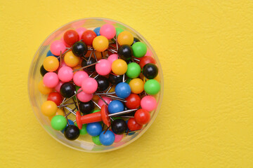 Colorful pushpins in the plastic box. pushpins are useful for affixing studies, bits of...