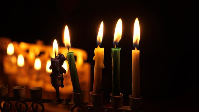 Four candles and the Shamash candle burning in the Menorah during Jewish Hanukkah