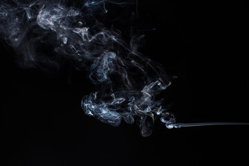 Abstract smoke on black background. Light blue texture. Design element.	
