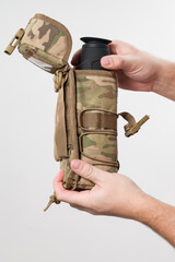 Military monocular in a case for storage and portability.