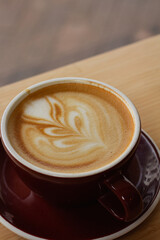 cup of coffee on wooden table