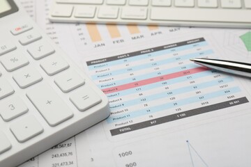 Naklejka na ściany i meble Pen, calculator and computer keyboard on accounting documents with data, closeup