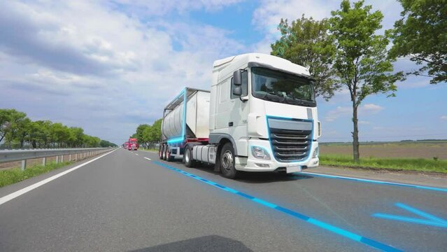 Delivery of goods with a smart truck. A smart truck delivers goods. Smart self-driving truck on the highway.