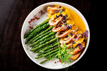 Baked fresh asparagus with wrapped meat 