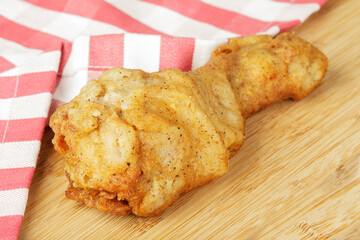 Fried Chicken Leg or Drumstick on a wooden Background Copy Space