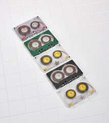 Audio cassettes lie in a row. Vintage music and technology concept.