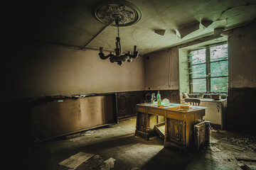 The rotten old house with a missing wall.