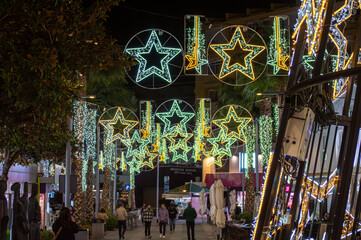 Capture the festive charm of the Christmas lights and tree in Torremolinos, Spain