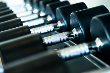Rows of dumbbells in the gym