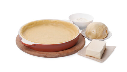 Pie tin with fresh dough and ingredients isolated on white. Making quiche