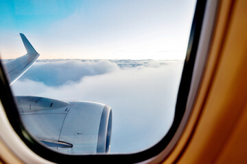 Airplane engine and wings on the sky © xy