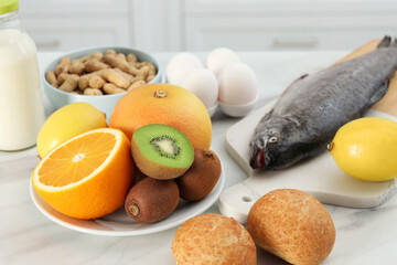 Allergenic food. Different fresh products on light table, closeup