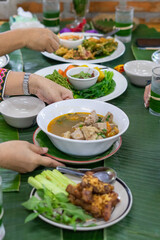 Tradition Northern Thai food. on a wooden table
