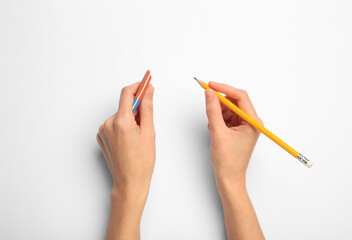 Woman with graphite pencil and eraser on white background, top view