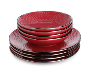 Stack of red bowls and plates isolated on white