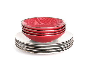 Stack of beautiful ceramic plates and bowls isolated on white