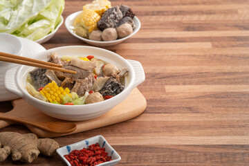 Delicious ginger duck hot pot soup with fresh vegetables in Taiwan.