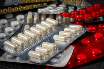 Different medicines: tablets, pills in blister pack.