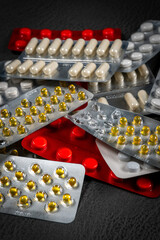 Different medicines: tablets, pills in blister pack.