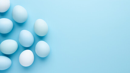 Pastel Easter eggs on blue background top view