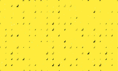 Seamless background pattern of evenly spaced black hare symbols of different sizes and opacity. Vector illustration on yellow background with stars