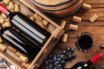 Winemaking. Flat lay composition with tasty wine and barrel on wooden table