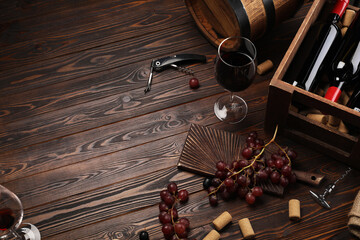 Winemaking. Composition with tasty wine and barrel on wooden table, above view. Space for text