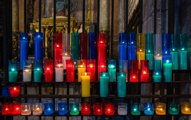 Obraz premium Multicolored burning church candles