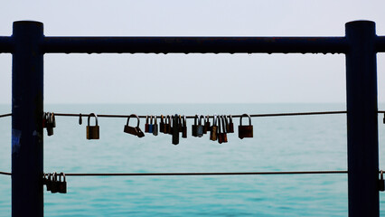 Padlocks on a fence over the lake Balaton in Siofok, Hungary