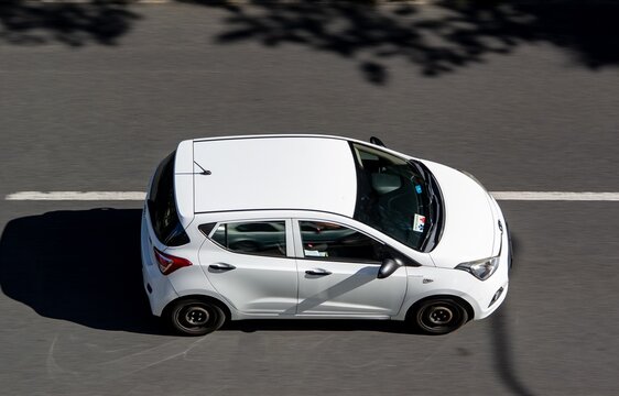 White Hyundai i10 micro car, the 2nd generation in motion blur effect