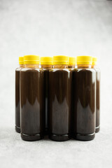 Fresh dark cocoa products in plastic bottles ready for sale in bottle quite popular take to home