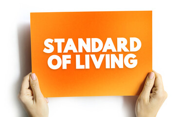 Standard of Living is the level of income, comforts and services available, generally applied to a society or location, text concept on card