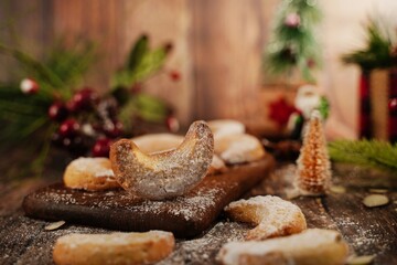 Holiday Almond crescent shortbread cookies on festive background, selective focus