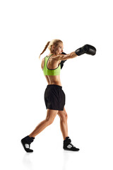 Fototapeta premium Jab punch. Young sportive woman with muscularly fit body practicing boxing isolated over white background. Concept of sport, active and healthy lifestyle, strength and endurance, body care