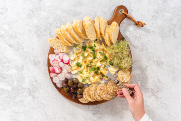 Butter board with vegetables and bread