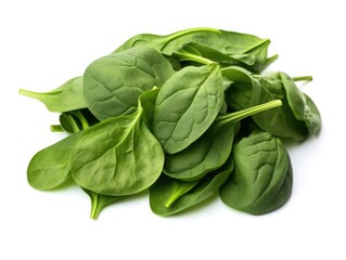 A pile of spinach leaves on a white surface.