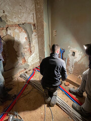 Electrician working working on building site, Maintenance technicians install wiring in the home....