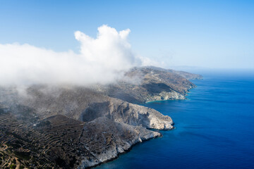 Landscape of Folegandros Island with a cloud and blue sky. Aegean Sea. Cyclades of Greece.