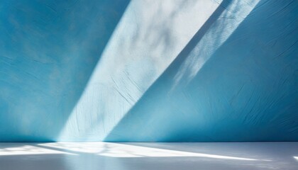 an original background image for design or product presentation with a play of light and shadow in light blue tones