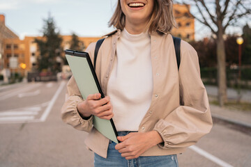 half-portrait of a smiling and beauty student girl.